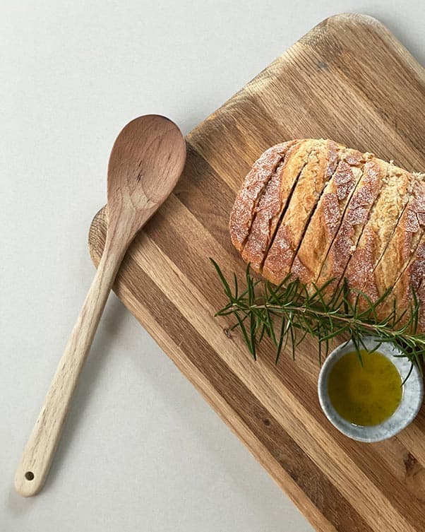 Wooden spoon resting on chopping board