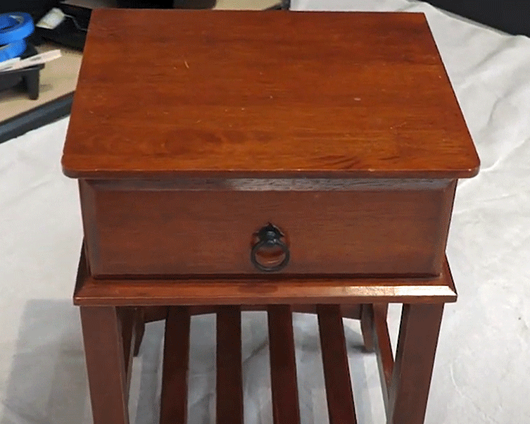 Removing existing varnish from bedside table using Intergrain Timber Stripper.