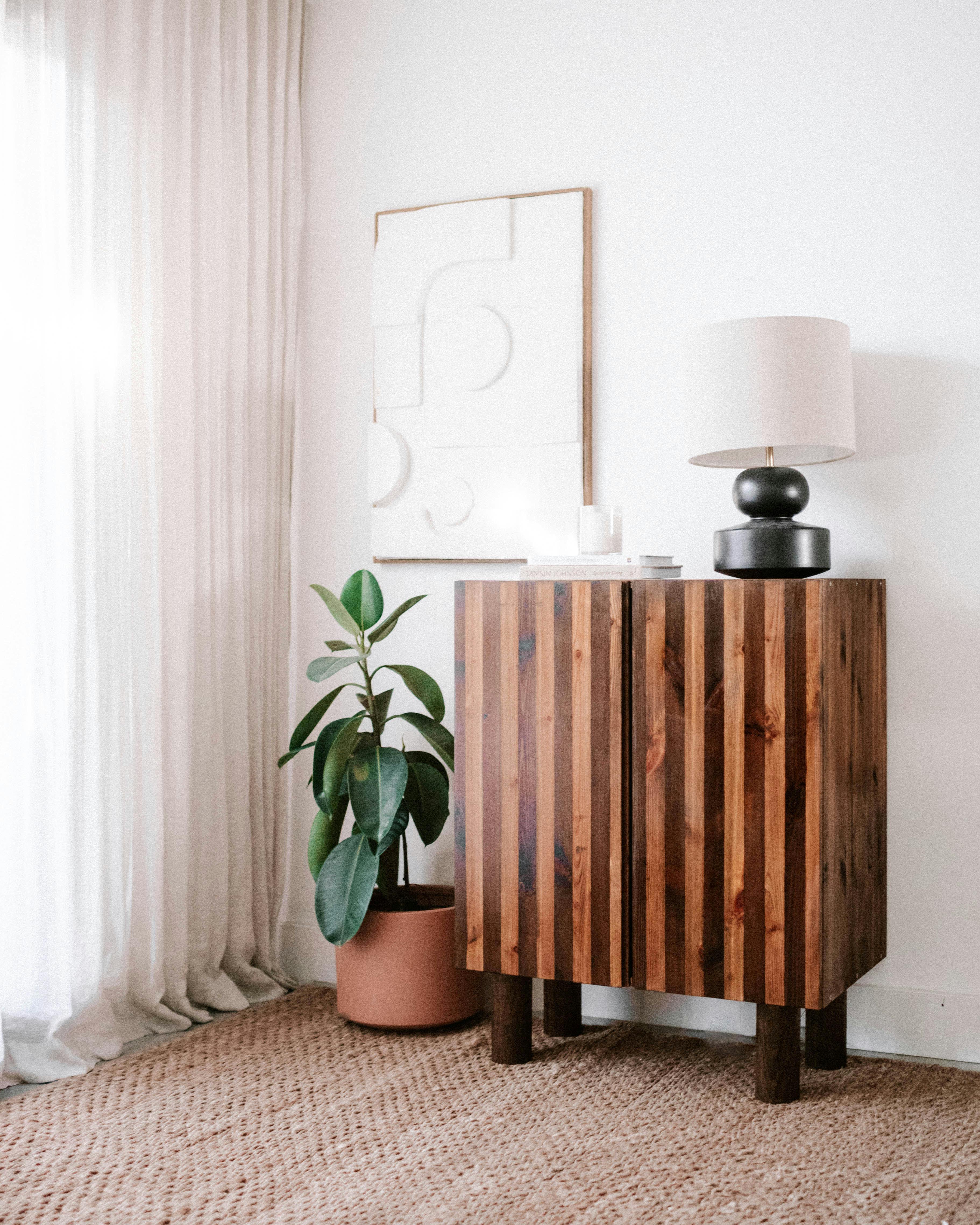 Striped cabinet styled with lamp