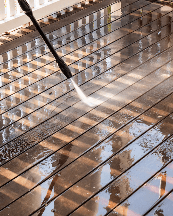 High pressure hosing a deck